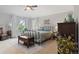 Comfortable main bedroom boasts great light and has neutral carpeting at 17297 Opal Hill Dr, Parker, CO 80134