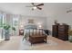 Spacious main bedroom with a ceiling fan, natural light, and elegant furnishings at 17297 Opal Hill Dr, Parker, CO 80134