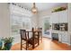 Charming breakfast nook with a round table, stylish light fixture, and a view of the outdoor scenery at 17297 Opal Hill Dr, Parker, CO 80134