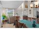 Inviting dining area with wood table and chairs, adjacent to a cozy living room with bright natural light at 17297 Opal Hill Dr, Parker, CO 80134