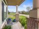 Charming front porch showcasing wood flooring, decorative pillars, and neighborhood views at 17297 Opal Hill Dr, Parker, CO 80134