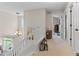 Bright hallway features a chandelier, artwork and a view towards other rooms at 17297 Opal Hill Dr, Parker, CO 80134