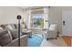 Cozy living room with large window, comfortable seating, and abundant natural light at 17297 Opal Hill Dr, Parker, CO 80134