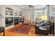 Comfortable living room featuring a fireplace, hardwood floors, and natural light for a welcoming atmosphere at 17297 Opal Hill Dr, Parker, CO 80134
