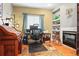 Cozy office provides a dedicated workspace with nice light and custom built-in shelves at 17297 Opal Hill Dr, Parker, CO 80134