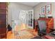 Office area with a view toward the home's entry hall is spacious and well-lit at 17297 Opal Hill Dr, Parker, CO 80134