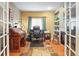 Cozy home office provides a dedicated workspace with nice light and built-in shelves at 17297 Opal Hill Dr, Parker, CO 80134