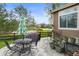 Inviting patio with outdoor seating, grill, and umbrella perfect for entertaining and enjoying the outdoors at 17297 Opal Hill Dr, Parker, CO 80134