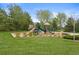 A colorful playground with multiple slides and climbing structures, set in a well-maintained park at 17297 Opal Hill Dr, Parker, CO 80134