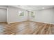 Spacious basement with wood-look flooring and plenty of natural light at 2562 S Kendrick St, Denver, CO 80228