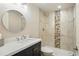Modern bathroom with a sleek sink, stylish fixtures, and an accessible shower with tasteful tile accents at 2562 S Kendrick St, Denver, CO 80228
