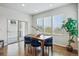 Bright dining room features a table and sliding door access to the outdoor deck at 2562 S Kendrick St, Denver, CO 80228