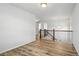 Hallway with hardwood floors and natural light from windows at 2562 S Kendrick St, Denver, CO 80228
