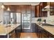 Well-equipped kitchen with stainless steel appliances, granite countertops, and ample cabinet space at 2562 S Kendrick St, Denver, CO 80228