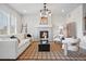 Cozy living room features fireplace, stylish furniture, and natural light at 2562 S Kendrick St, Denver, CO 80228