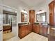 Main bathroom boasts double vanities and sinks with a bedroom view at 2571 Hunters Pl, Highlands Ranch, CO 80129