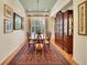 Formal dining room showcasing hardwood floors, classic chandelier, and refined china cabinet at 2571 Hunters Pl, Highlands Ranch, CO 80129