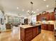 Open-concept kitchen with granite countertops, stainless steel appliances, and a spacious island at 2571 Hunters Pl, Highlands Ranch, CO 80129