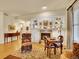 Cozy living room featuring hardwood floors, a fireplace, and built-in shelving for storage and decor at 2571 Hunters Pl, Highlands Ranch, CO 80129