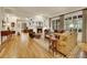 Comfortable living room with hardwood floors, fireplace, and large windows for ample natural light at 2571 Hunters Pl, Highlands Ranch, CO 80129