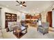 Open-concept living room with seamless flow to the kitchen and dining area at 2571 Hunters Pl, Highlands Ranch, CO 80129