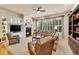 Bright living room with fireplace, built-in shelves, and lots of natural light at 2571 Hunters Pl, Highlands Ranch, CO 80129