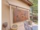 Outdoor patio featuring decorative wall art, potted plants, and comfortable seating area at 2571 Hunters Pl, Highlands Ranch, CO 80129