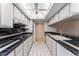 Galley kitchen with modern appliances and recessed lighting at 7000 E Quincy Ave # 204, Denver, CO 80237