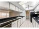 Cozy kitchen area showcasing black countertops and tiled floors at 7000 E Quincy Ave # 204, Denver, CO 80237