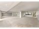 Bright open floor plan with mirrored wall and recessed lighting at 7000 E Quincy Ave # 204, Denver, CO 80237