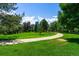 Scenic view of a city park with a winding path and green spaces under a bright sky at 7000 E Quincy Ave # 204, Denver, CO 80237