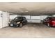 Parking garage with cars and storage spaces at 7000 E Quincy Ave # 204, Denver, CO 80237