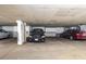 Parking garage with assigned parking spots and storage units for residents at 7000 E Quincy Ave # 204, Denver, CO 80237
