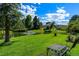 Scenic community pond with a fountain, lush greenery, seating, and a tranquil atmosphere at 7000 E Quincy Ave # 204, Denver, CO 80237