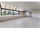 Bright sunroom featuring tiled floor and large windows with view at 7000 E Quincy Ave # 204, Denver, CO 80237