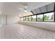 Sunroom with tiled floor, ceiling fan, and great view of the outdoors at 7000 E Quincy Ave # 204, Denver, CO 80237