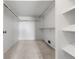 Walk-in closet with a carpeted floor, shelving, and hanging racks at 7000 E Quincy Ave # 204, Denver, CO 80237