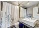 Modern bathroom with vessel sink, decorative shower curtain, and ample lighting for a refreshing space at 1201 Balsam Ave # 203, Boulder, CO 80304