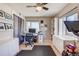 A versatile bonus room with an exercise area and a well-organized home office setup at 1201 Balsam Ave # 203, Boulder, CO 80304