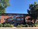 A well-maintained red brick building with tidy landscaping and inviting curb appeal at 1201 Balsam Ave # 203, Boulder, CO 80304