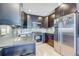 Modern kitchen featuring stainless steel appliances, sleek cabinetry and beautiful granite countertops at 1201 Balsam Ave # 203, Boulder, CO 80304
