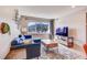 Comfortable living room featuring mountain views, a plush couch, and a stylish wood coffee table at 1201 Balsam Ave # 203, Boulder, CO 80304