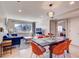 Inviting living room with mountain views, hardwood floors, a cozy blue sofa, and a dining area for entertaining at 1201 Balsam Ave # 203, Boulder, CO 80304
