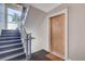 Stairwell featuring contemporary design elements and a well-lit entrance to unit 203 at 1201 Balsam Ave # 203, Boulder, CO 80304