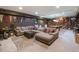 Finished basement with large sectional sofa, pool table and built-in bookshelves at 100 N Gaylord St, Denver, CO 80206