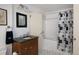 Bathroom with stylish black and white tile and a shower-tub combo at 100 N Gaylord St, Denver, CO 80206