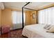 Bright bedroom with white curtains and a decorative rug at 100 N Gaylord St, Denver, CO 80206