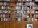 Detailed view of fully stocked custom library shelves with ladder at 100 N Gaylord St, Denver, CO 80206