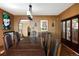 Formal dining room showcases a large table, elegant lighting, and classic architectural details at 100 N Gaylord St, Denver, CO 80206