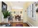 Warm entryway with lots of light with tile and hardwood floors at 100 N Gaylord St, Denver, CO 80206